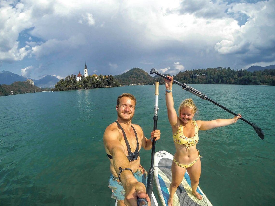 Gemma and Campbell Stand Up Paddle Boarding on Lake Bled