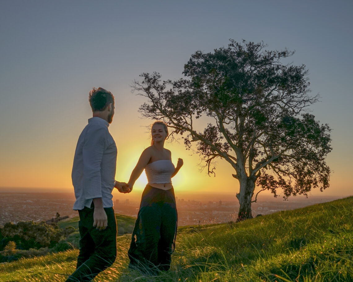 gemma and campbell on mt osmond at sunset