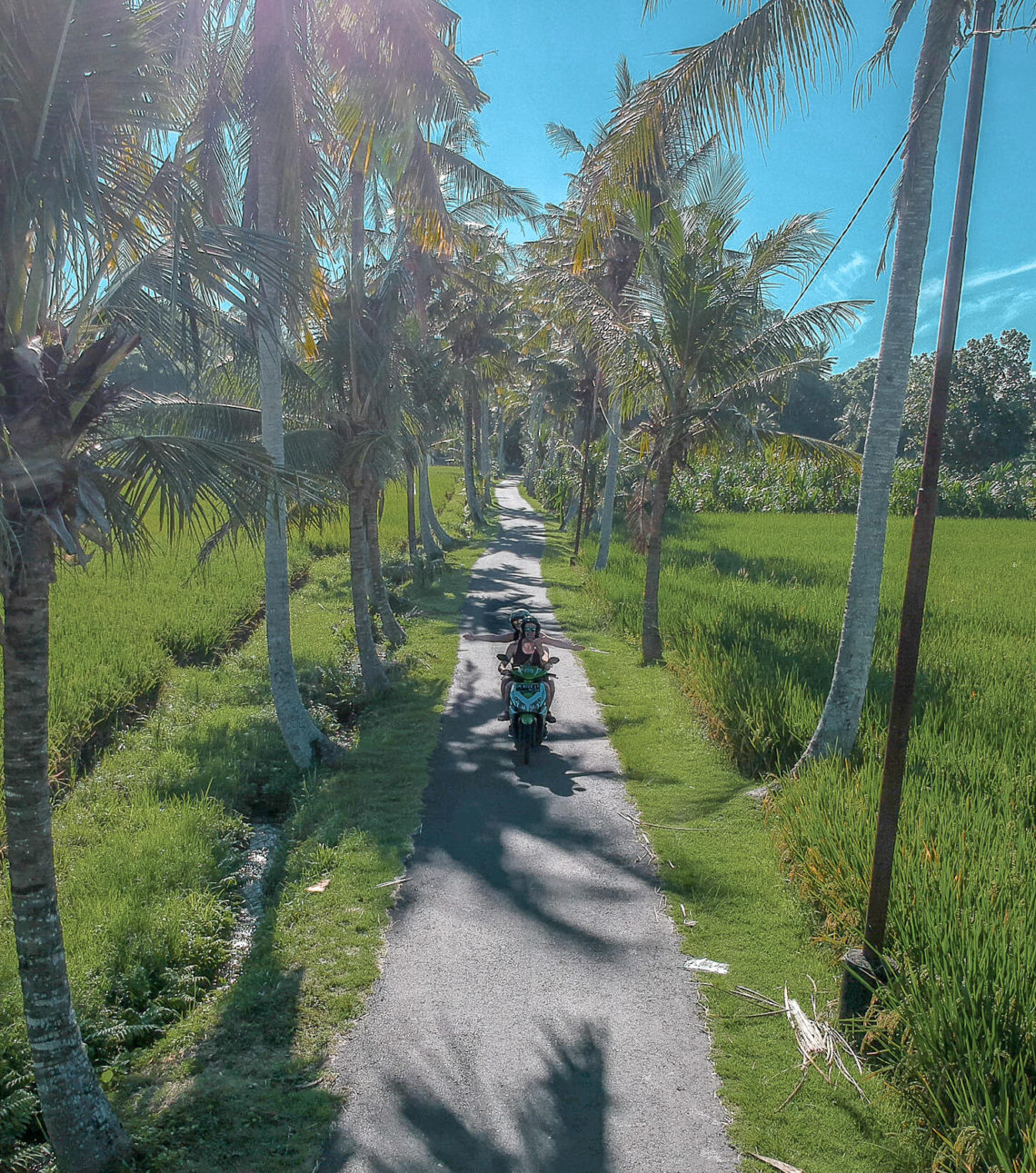 Gemma and Campbell Riding a Scooter in Bali