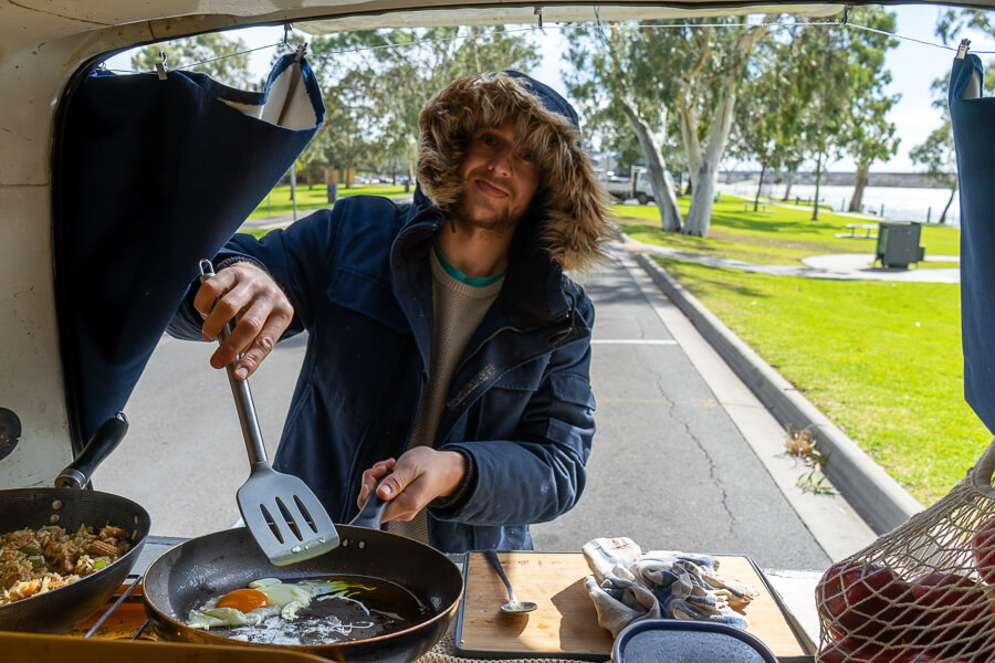 Campbell cooking at the back of the campervan