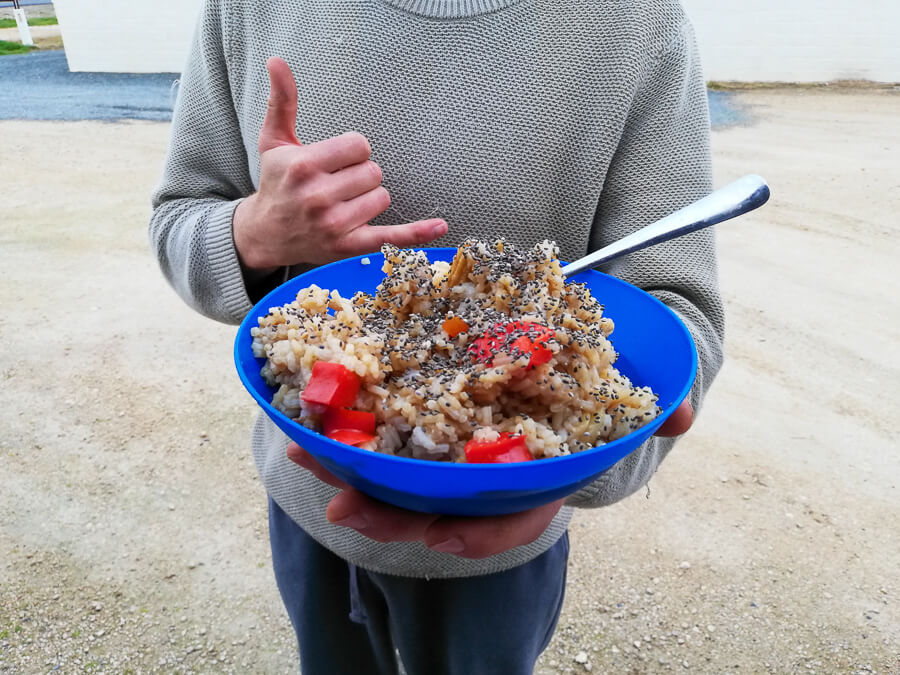 a bowl of nasi goreng tempe topped with a fried egg