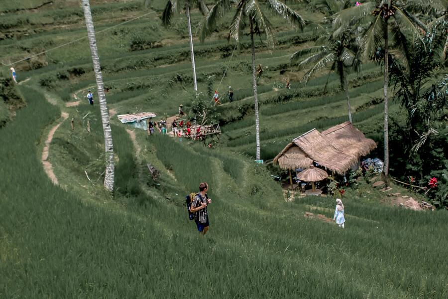 Walking through Tegalalang rice field with a fully packed bag.