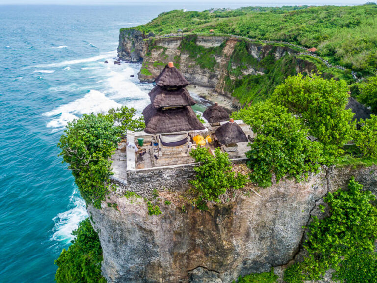 Uluwatu temple perched on the edge of the cliff from above.
