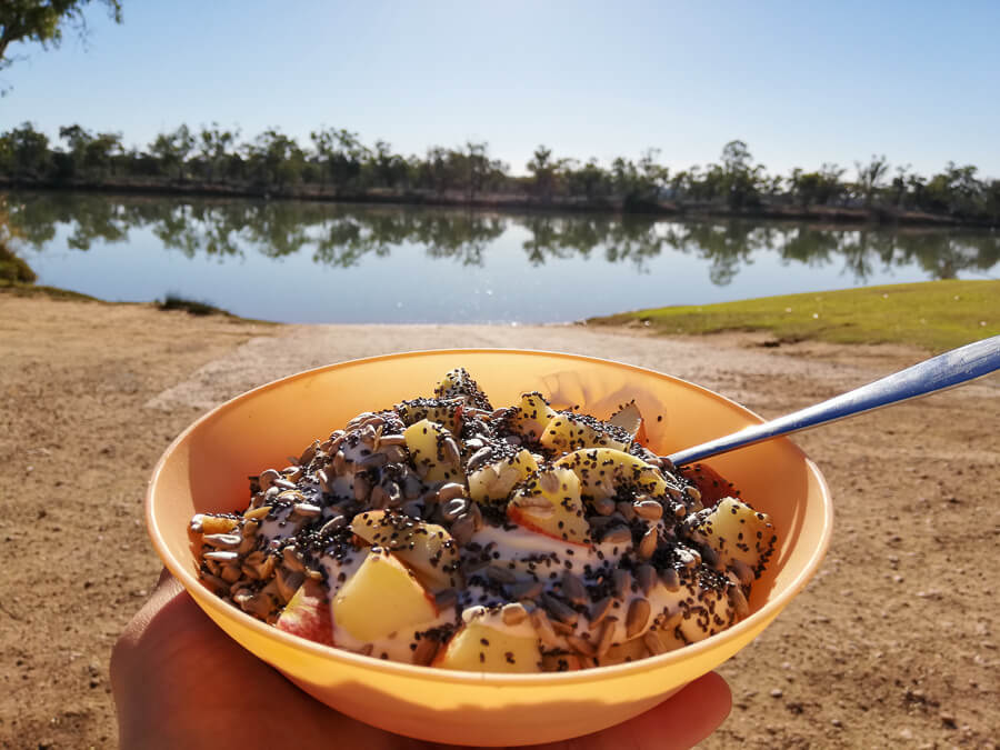 a bowl of granola, greek yoghurt and fruit