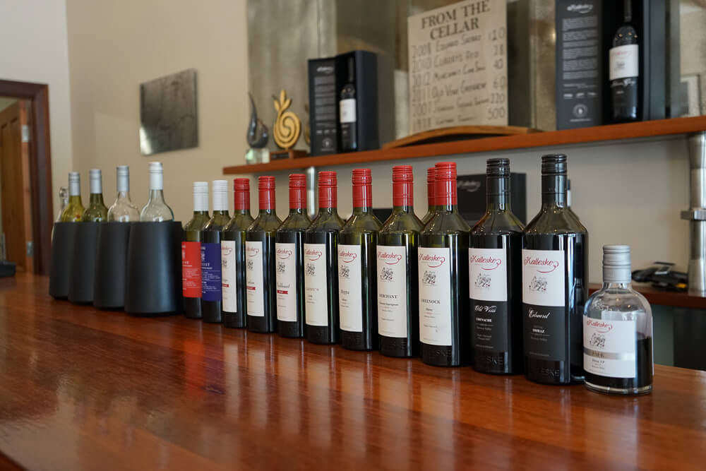 wine bottles on a bar in the winery