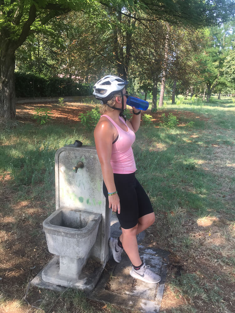 gemma drinking from a lifestraw waterbottle in italy