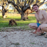 Campbell beside a friendly kangaroo at Stokes Bay.