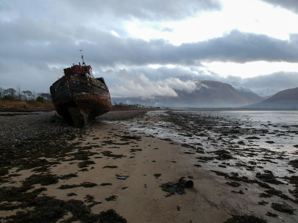 Corpach Boat sitting high on the beach.