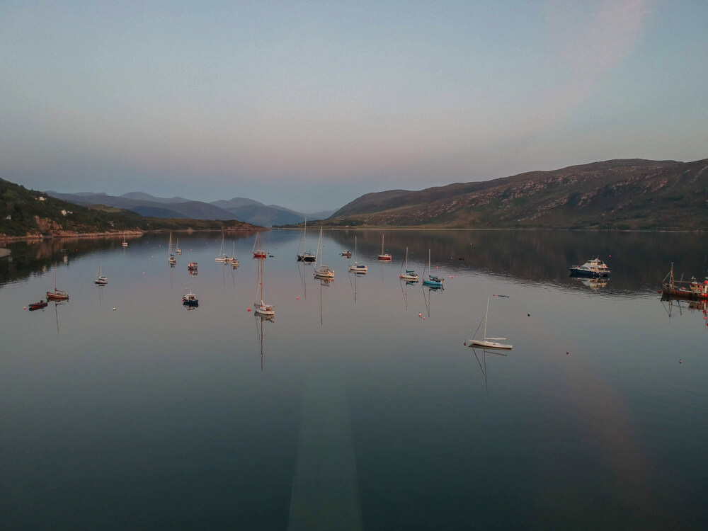 Stunning countryside views of the Ullapool harbour from a drone