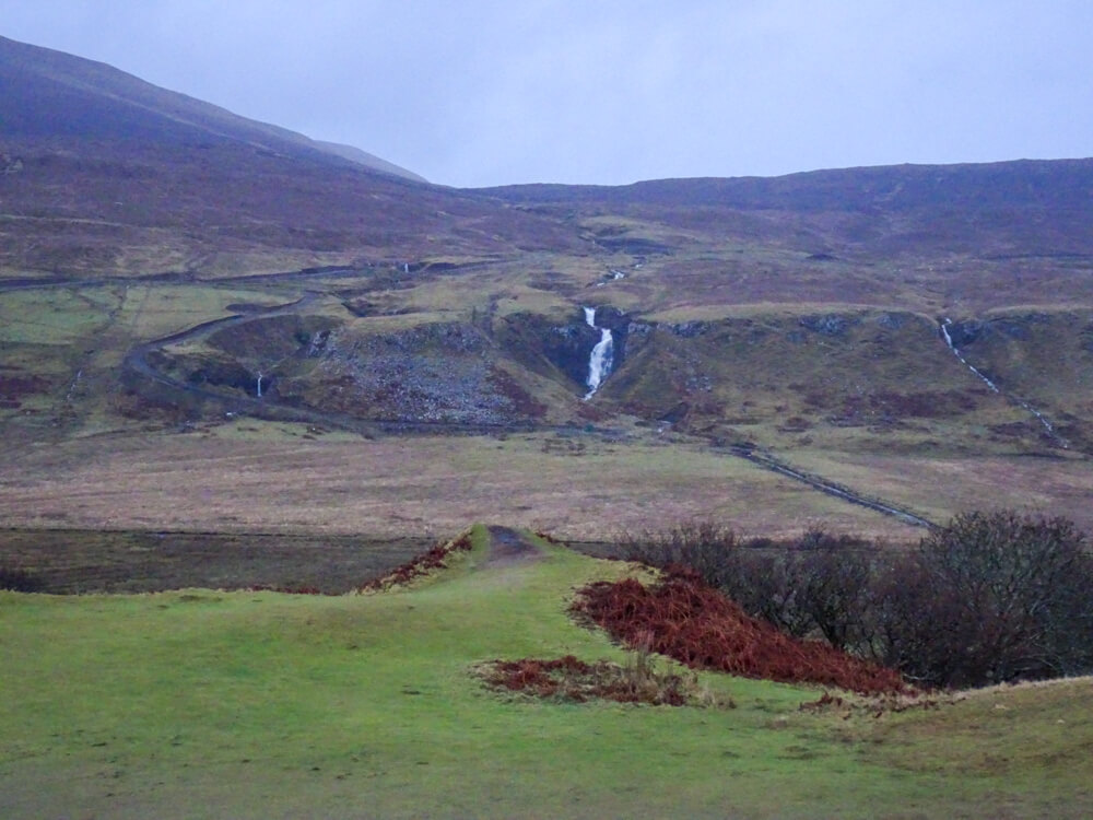 waterfalls in the distance at the fairy glens