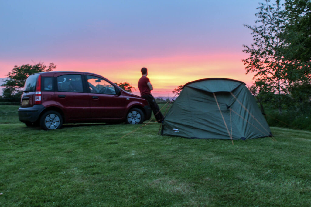 sunset car and tent
