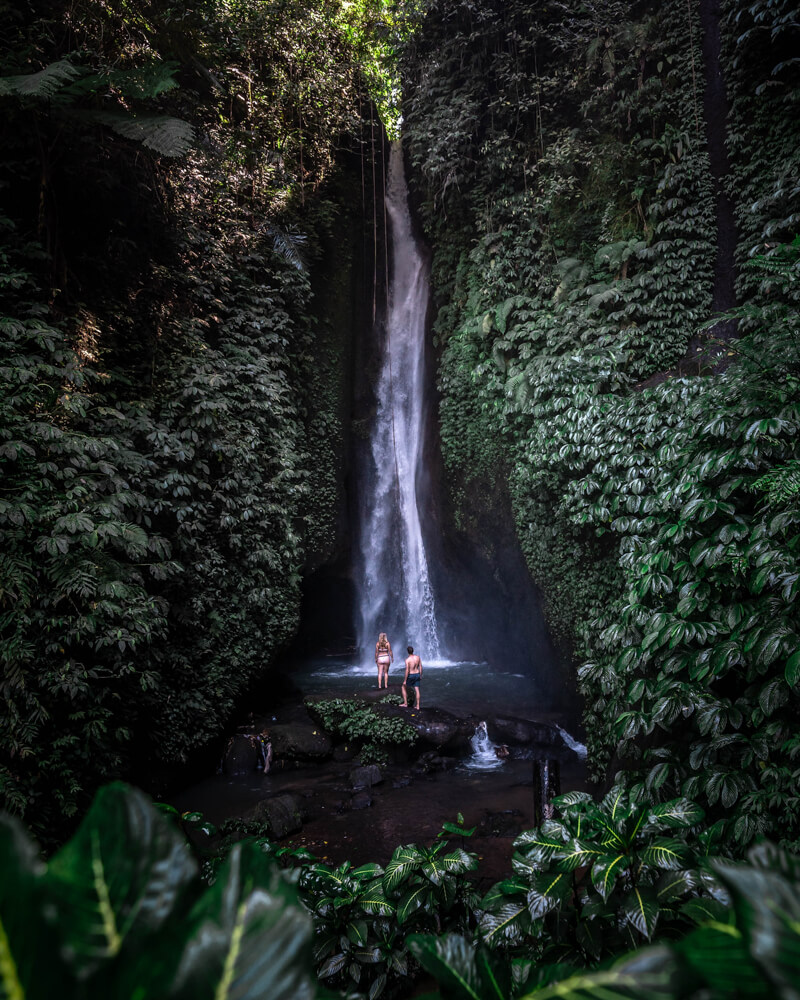 couple at leke leke waterfall bali