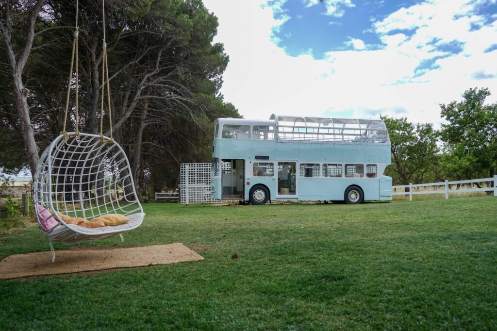 blue bus and hanging chair at down the rabbit hole winery