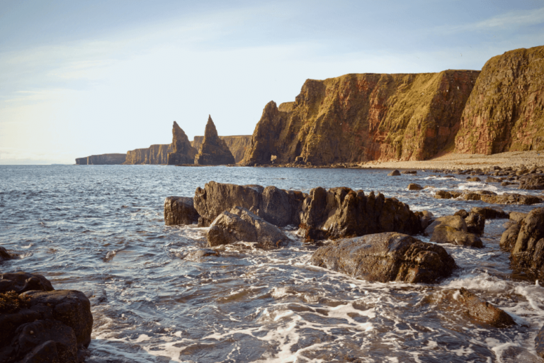 A low-angle shot of the distant Duncansby Stacks. These beauties are a highlight of our NC500 road trip.