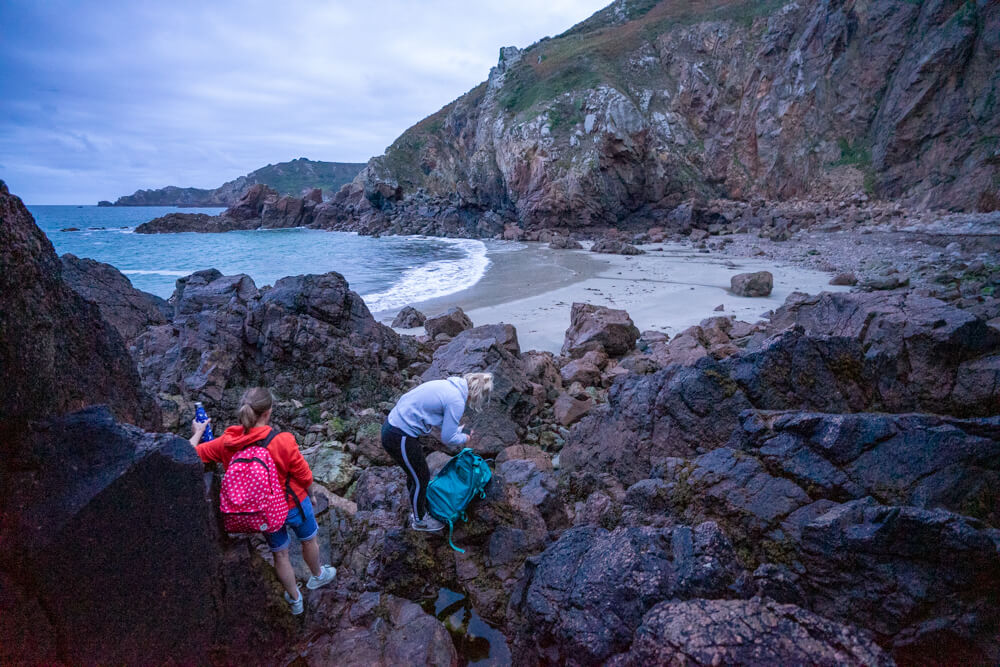 climbing the rocks at Le Jaonette Bay