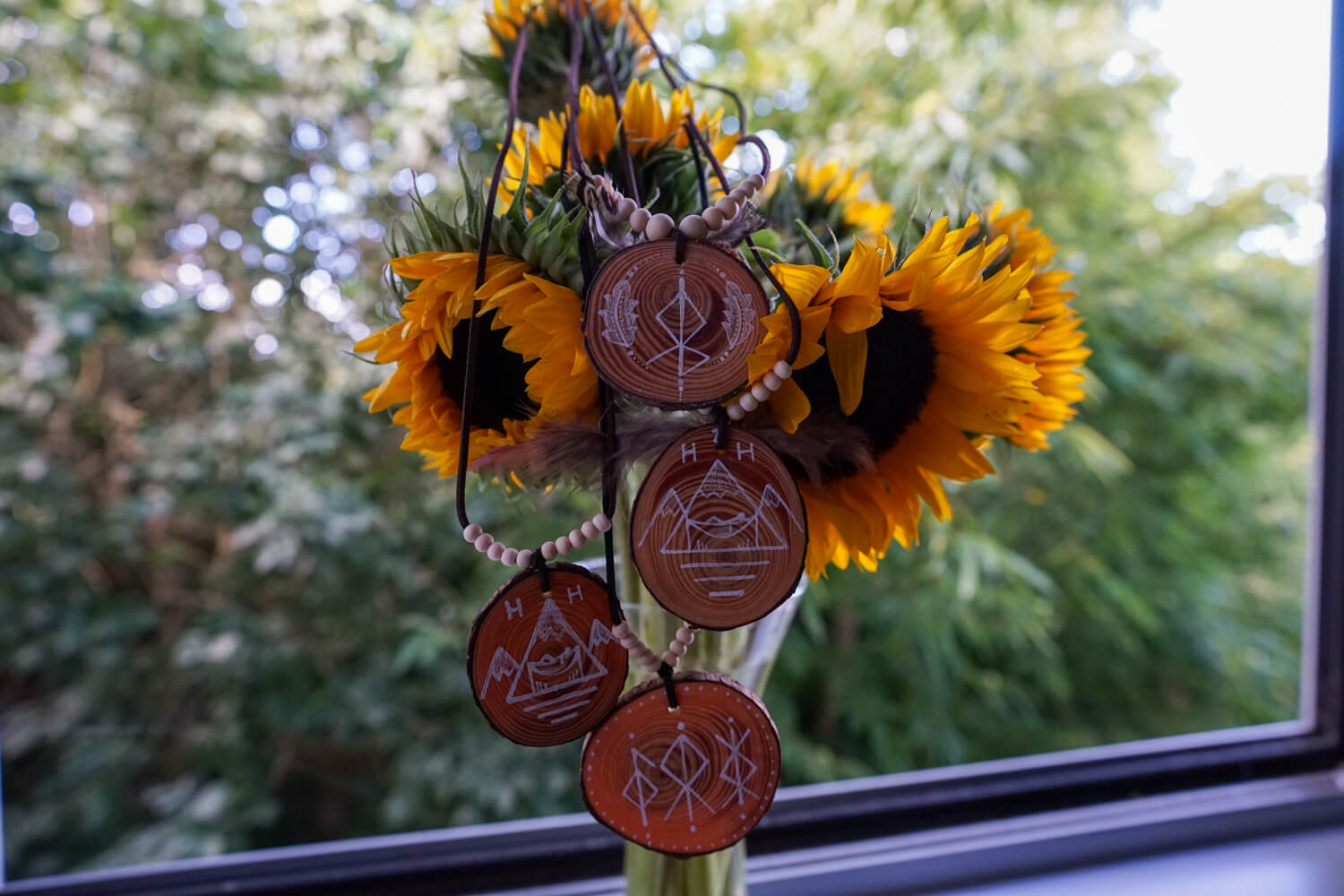 sunflowers with wooden necklaces hanging