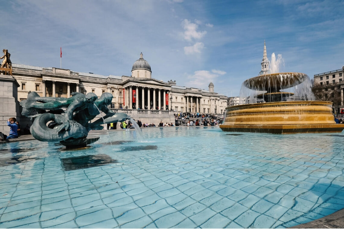 The impressive figure of the National Gallery stands proudly above the large congregation of statues and fountains on Trafalgar Square.