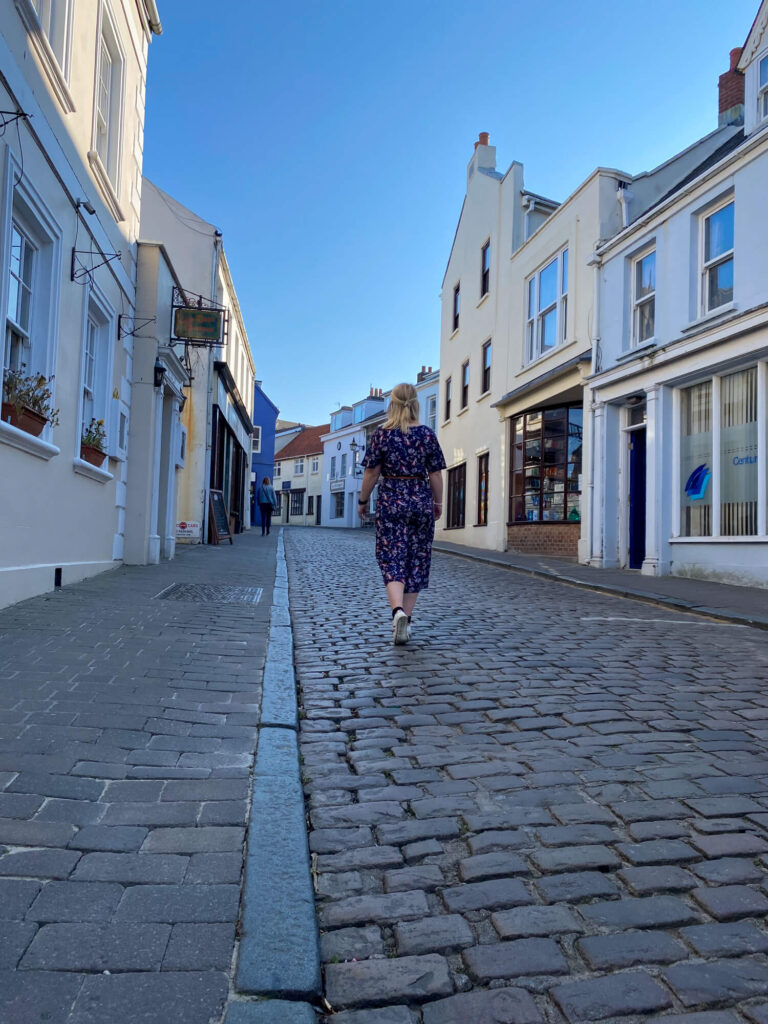 gemma walking on cobbled street