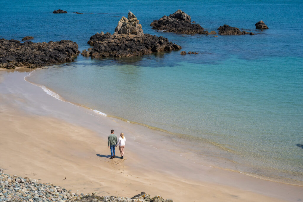 couple walking along beach