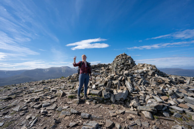 girl at summit of mealle a bhuachaille