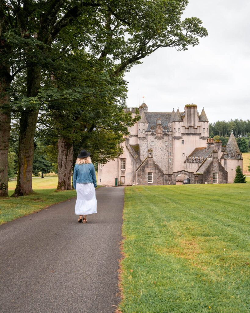 girl walking towards castle fraser