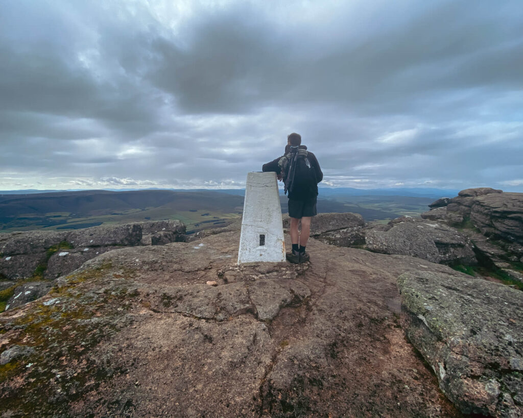 man at Ben Rhinnes summit