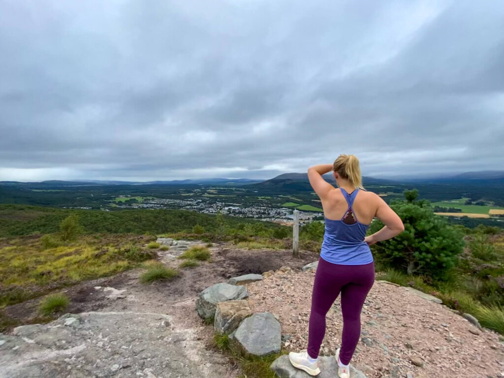 girl standing on Craigellachie and Loch Puladdern Circular