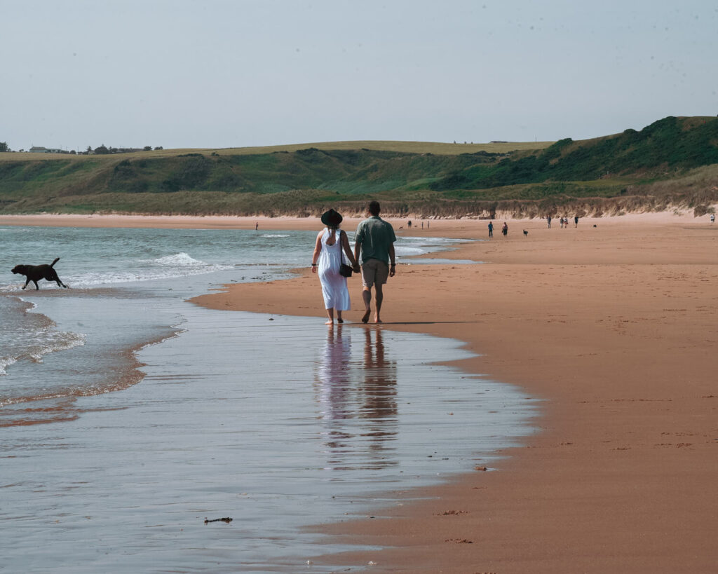 couple waling on cruden bay