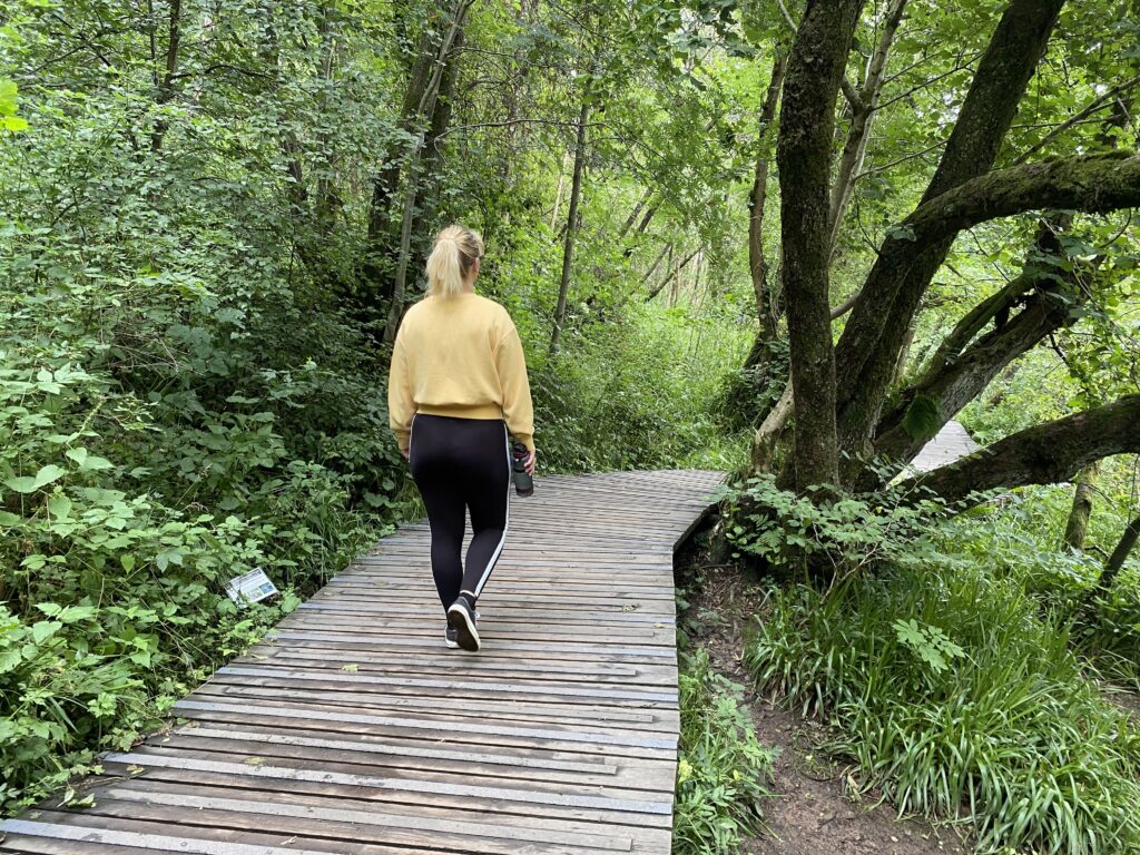 girl walking in woods