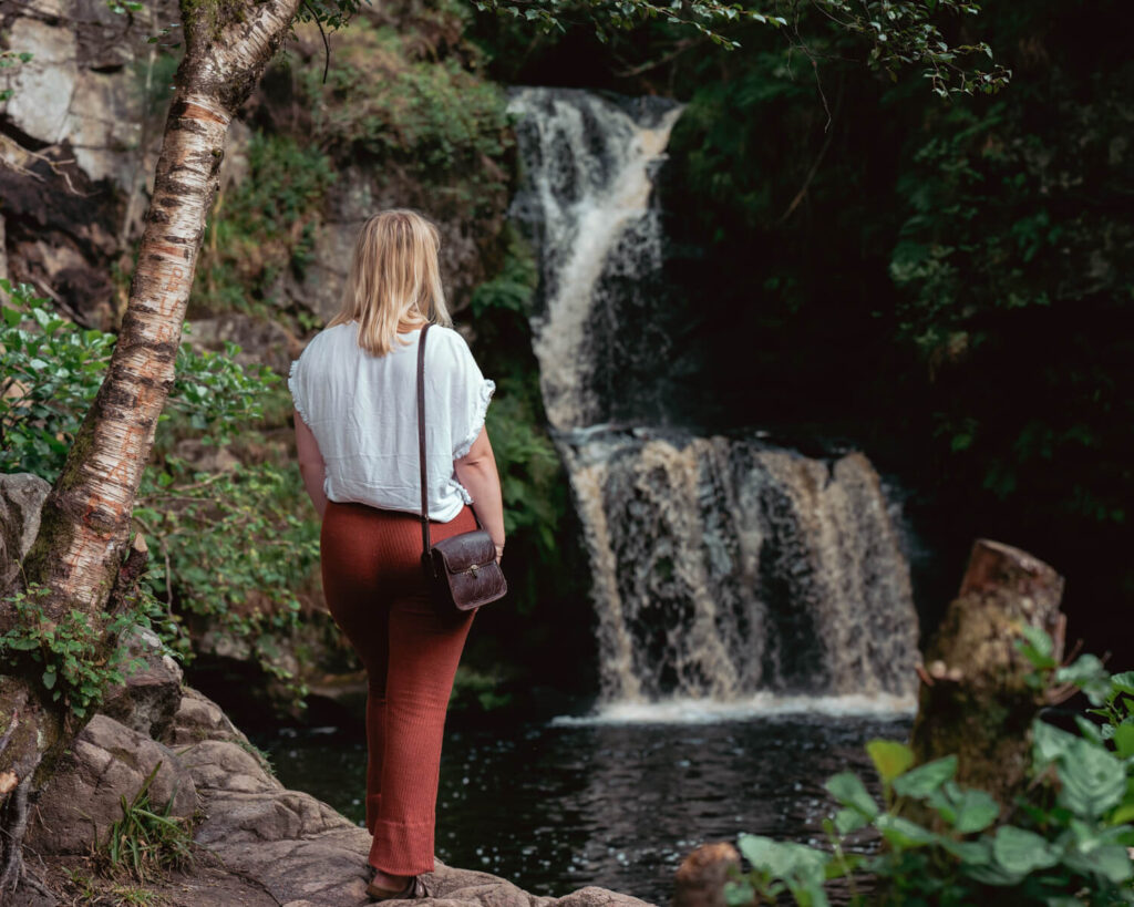 girl in front of waterfall