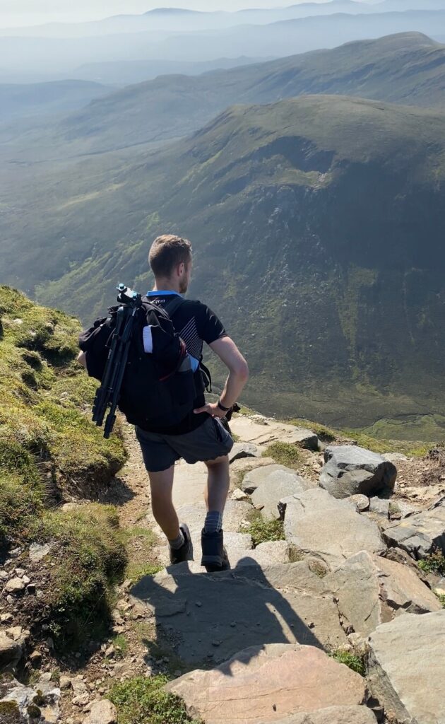 man standing on ben wyvis