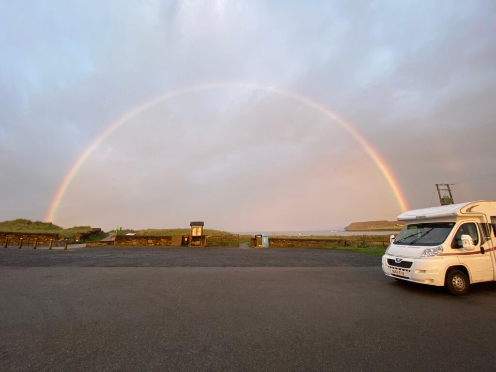 motorhome under rainbow