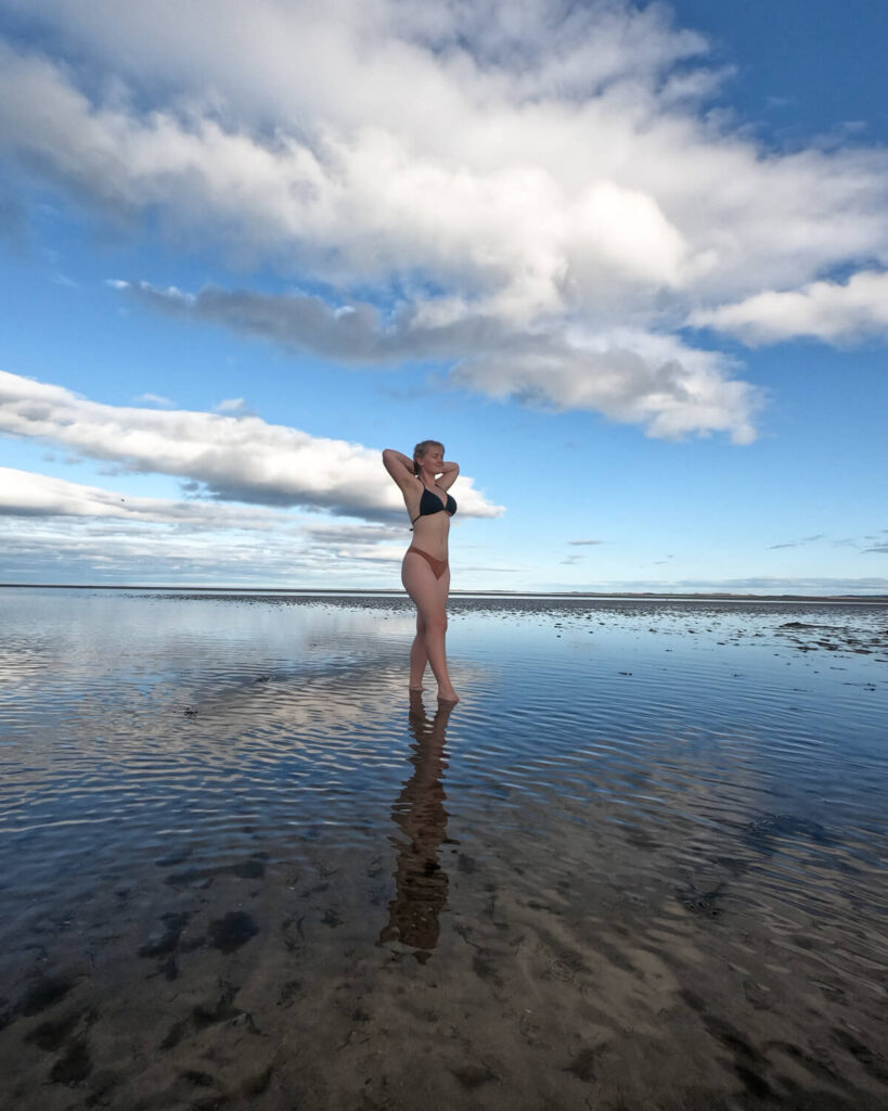 girl on dornoch beach