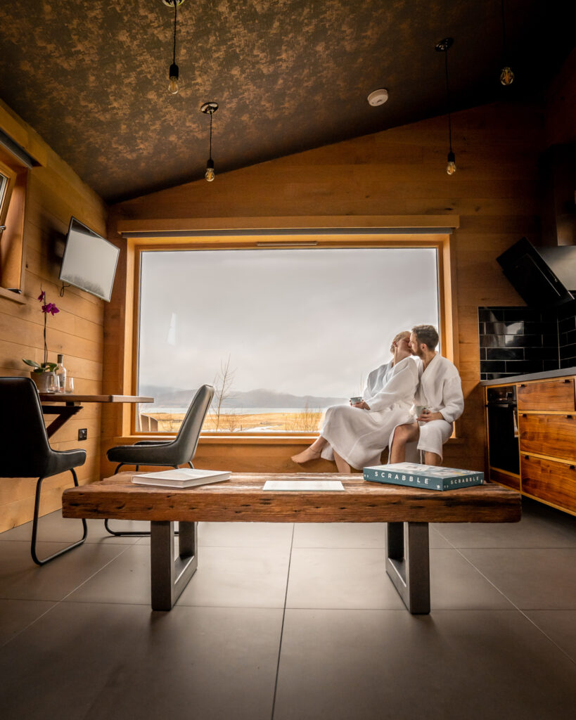 couple sitting on windowsill