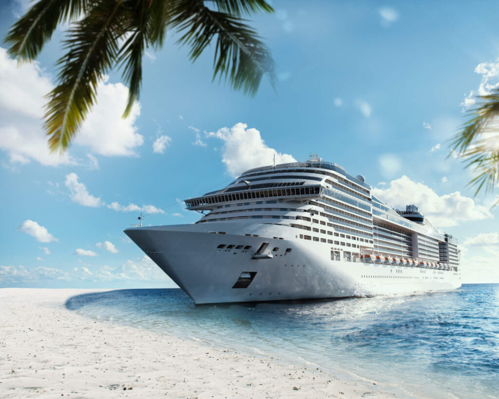 A cruise ship docked off of a remote beach
