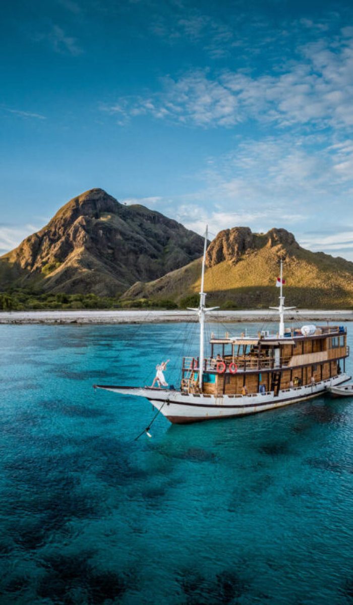 our komodo islands boat docked overlooking pink bay